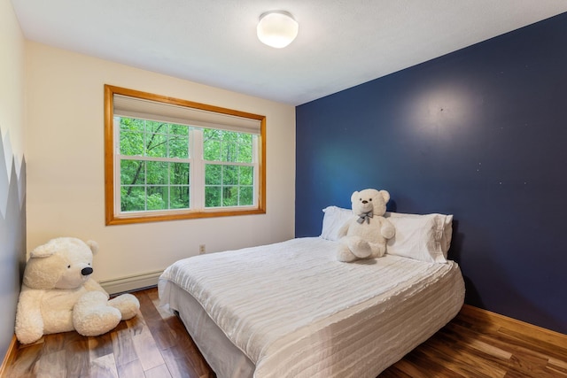 18 Ginger Ln, Saco, ME 04072 - bedroom featuring a baseboard heating unit, wood finished floors, and baseboards