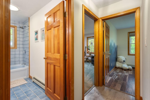 18 Ginger Ln, Saco, ME 04072 - hall with a baseboard heating unit, wood finished floors, and baseboards