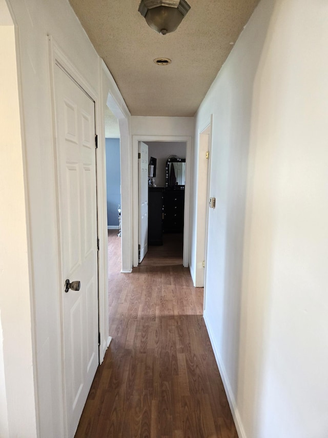 25 Mill Ln, Naples, ME 04055 - hallway with dark wood-type flooring and baseboards