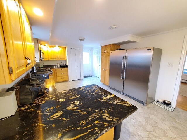 259-265 Bowden Point Rd, Prospect, ME 04981 - kitchen featuring high end refrigerator, dark countertops, and crown molding