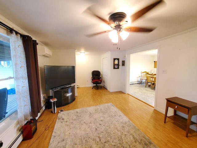 259-265 Bowden Point Rd, Prospect, ME 04981 - living area with a wall unit AC, ceiling fan, baseboard heating, light wood-style flooring, and crown molding