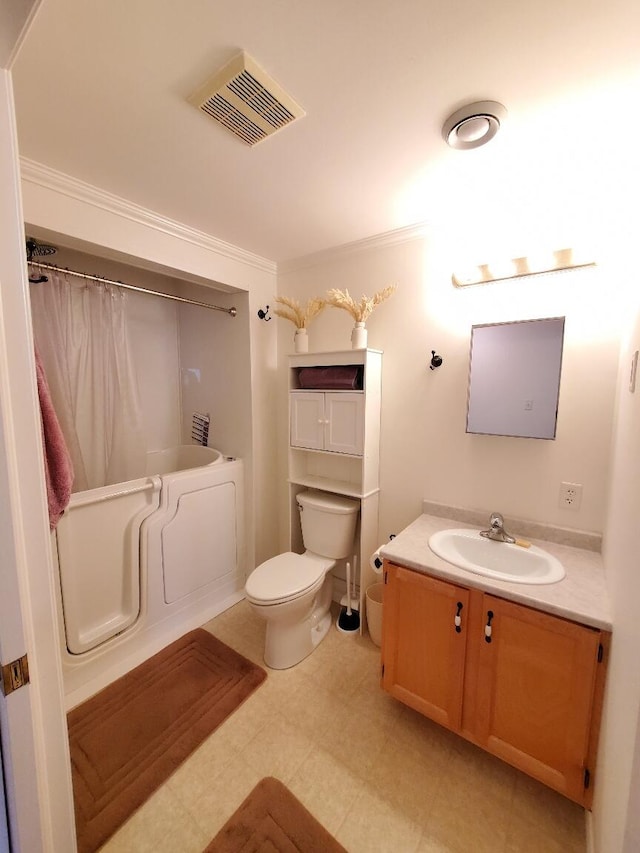 259-265 Bowden Point Rd, Prospect, ME 04981 - full bath with a tub to relax in, crown molding, toilet, vanity, and tile patterned floors