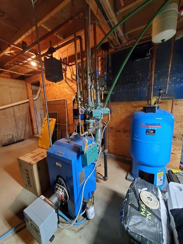 259-265 Bowden Point Rd, Prospect, ME 04981 - utility room with a heating unit