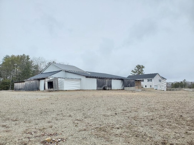 259-265 Bowden Point Rd, Prospect, ME 04981 - view of front of home with an outbuilding and metal roof