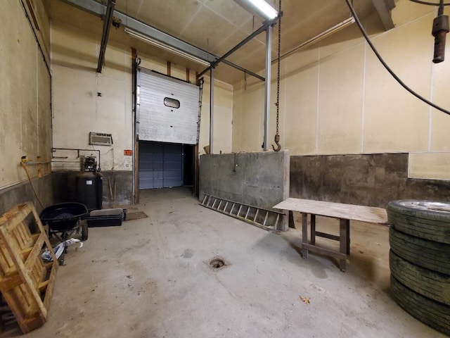 259-265 Bowden Point Rd, Prospect, ME 04981 - garage featuring an AC wall unit