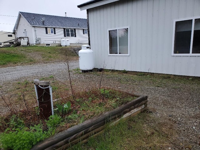 259-265 Bowden Point Rd, Prospect, ME 04981 - view of home's exterior with a garden and board and batten siding