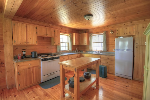113 W Arm Rd, Magalloway Plt, ME 04970 - kitchen featuring white appliances, a sink, wooden ceiling, light wood-style floors, and light brown cabinetry