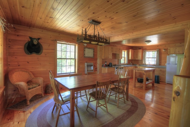 113 W Arm Rd, Magalloway Plt, ME 04970 - dining area featuring wooden ceiling, healthy amount of natural light, light wood-type flooring, and wood walls