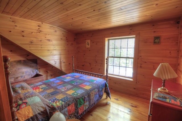 113 W Arm Rd, Magalloway Plt, ME 04970 - bedroom with wooden ceiling, wood finished floors, and wooden walls