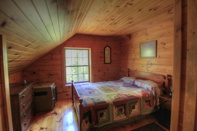 113 W Arm Rd, Magalloway Plt, ME 04970 - bedroom featuring vaulted ceiling, light wood-style floors, wood walls, and wooden ceiling