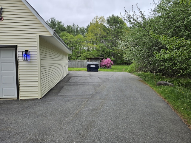 view of car parking with a garage