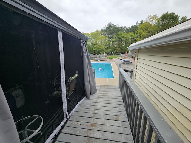 view of pool featuring view of scattered trees