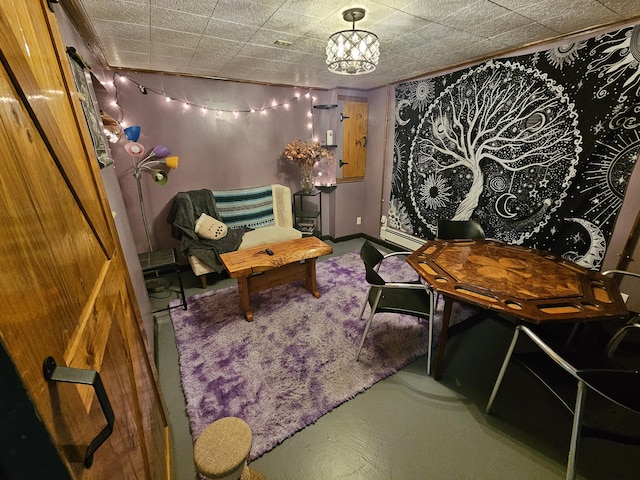 sitting room featuring carpet floors and baseboards