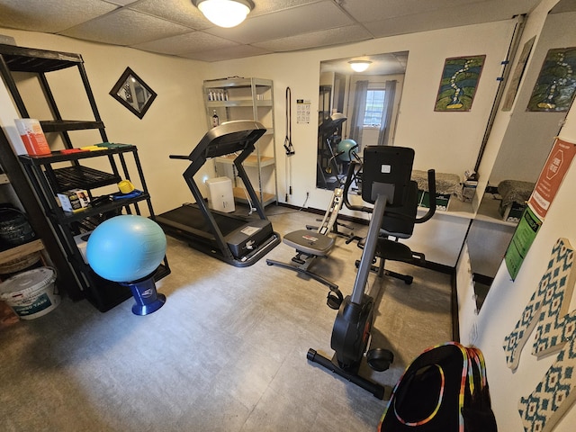 workout area with a paneled ceiling