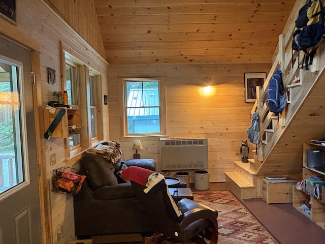 54 Orris Lamb Rd W, Dallas Plt, ME 04970 - living room featuring wooden walls, wood ceiling, heating unit, and lofted ceiling