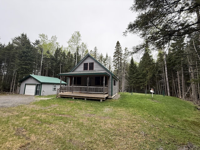 54 Orris Lamb Rd W, Dallas Plt, ME 04970 - view of front facade featuring an outbuilding, a front lawn, covered porch, and a view of trees