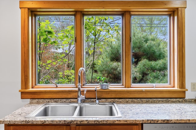 21 Harpswell Islands Rd, Harpswell, ME 04079 - kitchen featuring a sink, stainless steel dishwasher, healthy amount of natural light, and light stone counters