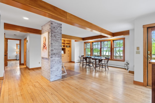 21 Harpswell Islands Rd, Harpswell, ME 04079 - dining room featuring beam ceiling, decorative columns, light wood-type flooring, healthy amount of natural light, and baseboards