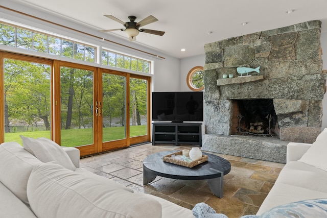 21 Harpswell Islands Rd, Harpswell, ME 04079 - living room featuring stone tile flooring, ceiling fan, recessed lighting, and a fireplace