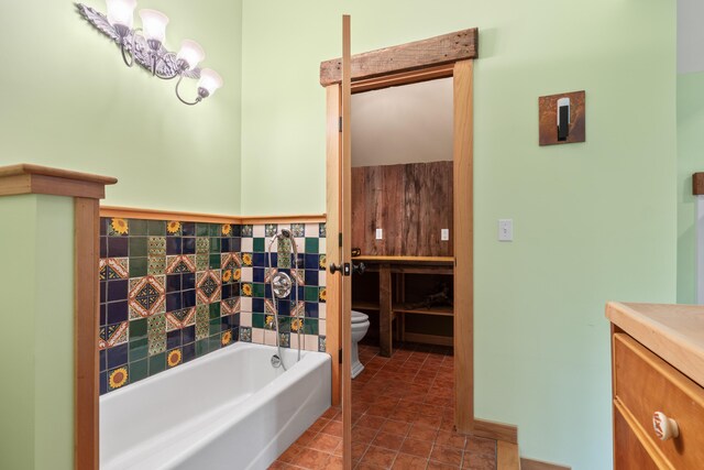 21 Harpswell Islands Rd, Harpswell, ME 04079 - bathroom featuring toilet, vanity, a bath, and tile patterned floors