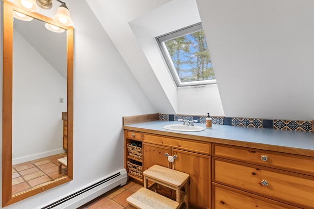 21 Harpswell Islands Rd, Harpswell, ME 04079 - bathroom with a skylight, a baseboard heating unit, vanity, and tile patterned floors
