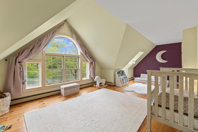21 Harpswell Islands Rd, Harpswell, ME 04079 - bedroom featuring vaulted ceiling, wood finished floors, baseboard heating, and a nursery area