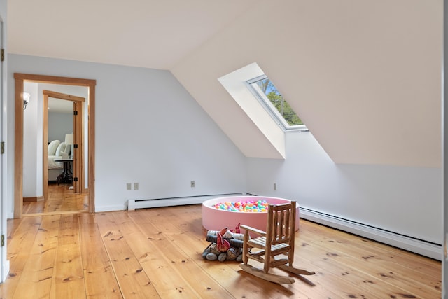 21 Harpswell Islands Rd, Harpswell, ME 04079 - rec room featuring a skylight, a baseboard heating unit, vaulted ceiling, and hardwood / wood-style floors