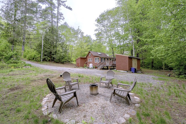 107 Meadow Rd, Raymond, ME 04071 - view of yard with an outdoor fire pit and a deck