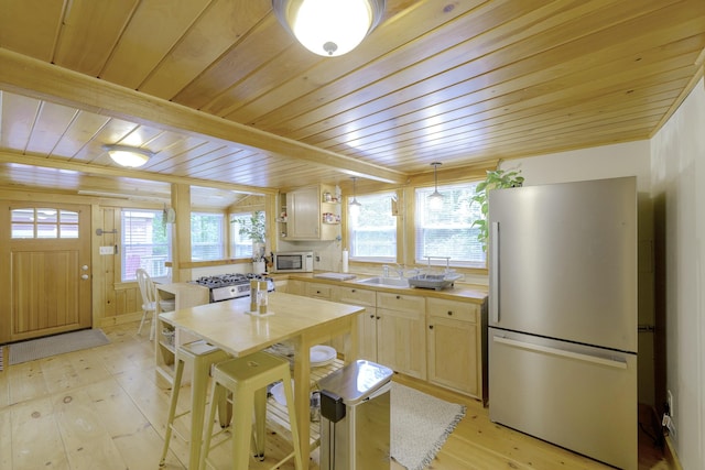 107 Meadow Rd, Raymond, ME 04071 - kitchen with freestanding refrigerator, wood ceiling, butcher block countertops, light wood-style flooring, and healthy amount of natural light