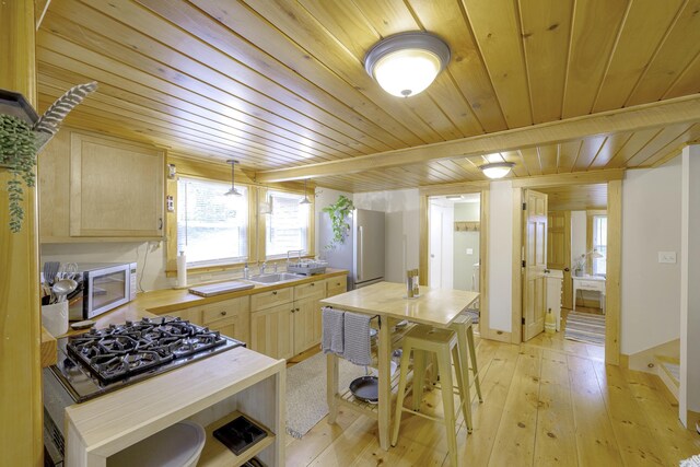 107 Meadow Rd, Raymond, ME 04071 - kitchen featuring wooden ceiling, light brown cabinetry, wooden counters, cooktop, and light wood-type flooring
