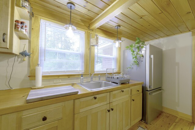 107 Meadow Rd, Raymond, ME 04071 - kitchen with wood ceiling with exposed beams, a sink, pendant lighting, light wood finished floors, and wood counters