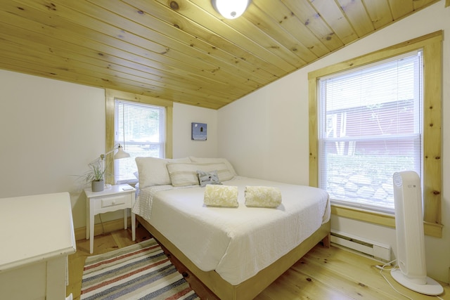 107 Meadow Rd, Raymond, ME 04071 - bedroom featuring a baseboard heating unit, vaulted ceiling, light wood-style floors, baseboards, and wood ceiling