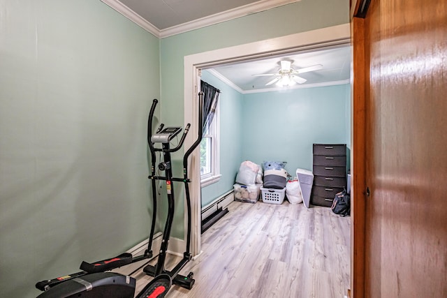 45 High St, Biddeford, ME 04005 - workout room featuring crown molding, wood finished floors, baseboard heating, a ceiling fan, and baseboards