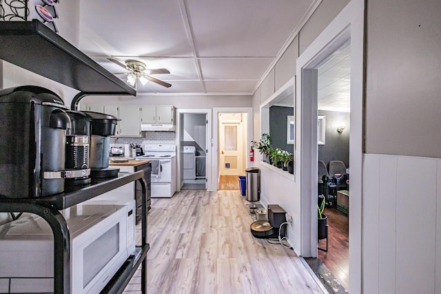 45 High St, Biddeford, ME 04005 - kitchen with white appliances, under cabinet range hood, a ceiling fan, and light wood finished floors