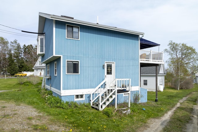 197 Ash Point Rd, Harpswell, ME 04079 - back of house with a balcony and a lawn