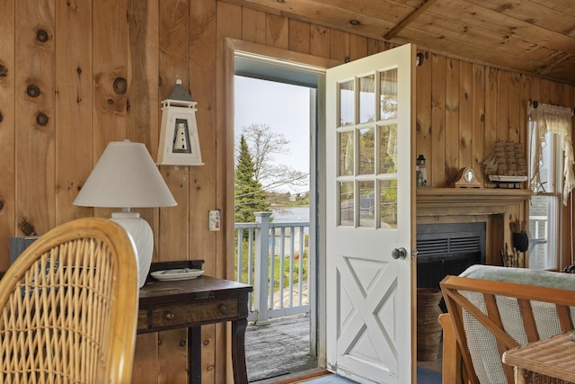 197 Ash Point Rd, Harpswell, ME 04079 - doorway to outside featuring wooden walls, wood ceiling, and a fireplace