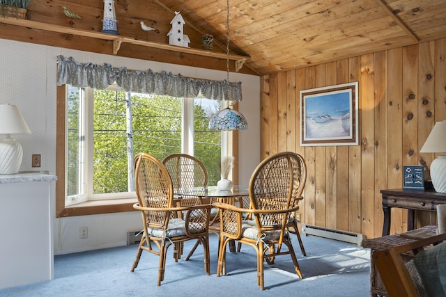 197 Ash Point Rd, Harpswell, ME 04079 - carpeted dining space with lofted ceiling, a baseboard radiator, wooden walls, and wooden ceiling