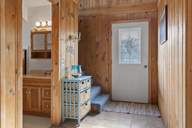 197 Ash Point Rd, Harpswell, ME 04079 - entryway with wooden walls and light tile patterned floors