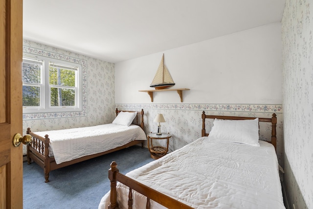 197 Ash Point Rd, Harpswell, ME 04079 - bedroom with wallpapered walls and carpet flooring