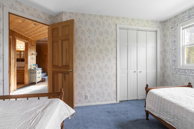 197 Ash Point Rd, Harpswell, ME 04079 - bedroom with carpet floors, a closet, and wallpapered walls