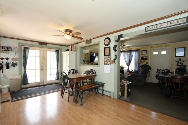 58 Skeetfield Rd, Oxford, ME 04270 - dining area featuring ceiling fan, baseboard heating, ornamental molding, french doors, and light wood finished floors