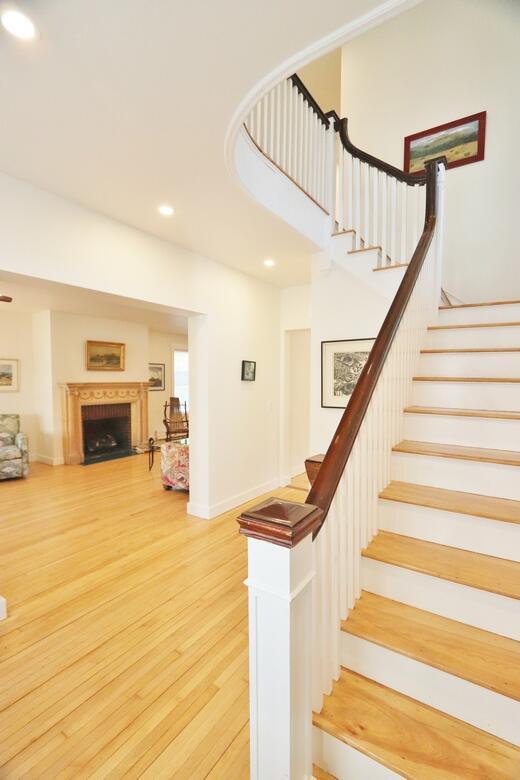 228 French St, Bangor, ME 04401 - stairs with wood finished floors, recessed lighting, and a fireplace