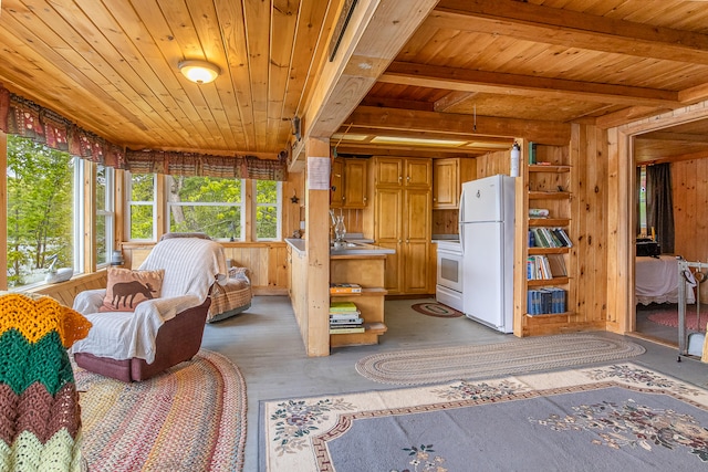 72 Logan Cir, Waterboro, ME 04030 - interior space featuring freestanding refrigerator, wooden ceiling with exposed beams, wood walls, light wood-style floors, and range