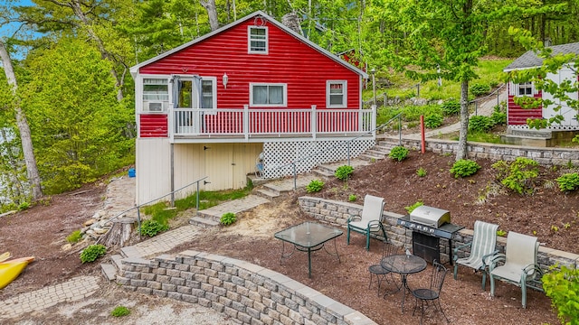 72 Logan Cir, Waterboro, ME 04030 - rear view of property featuring stairway and a wooden deck