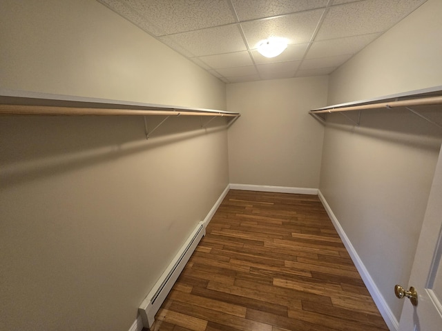 101 Streamside Ln Unit 21, Bangor, ME 04401 - walk in closet featuring a baseboard heating unit, dark wood finished floors, and a paneled ceiling