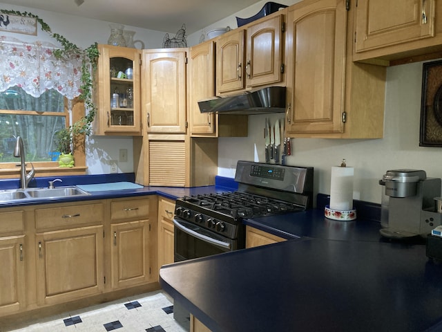 34 Highview Ave, Hancock, ME 04640 - kitchen with under cabinet range hood, range with gas stovetop, a sink, dark countertops, and light floors