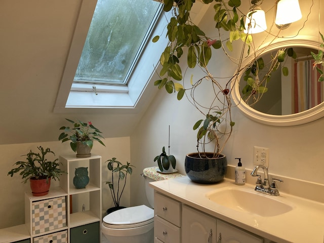 34 Highview Ave, Hancock, ME 04640 - bathroom featuring a skylight, toilet, and vanity