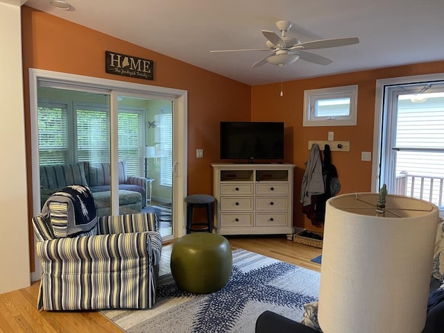 412 Post Rd Unit 253, Wells, ME 04090 - living area featuring wood finished floors, vaulted ceiling, and a ceiling fan