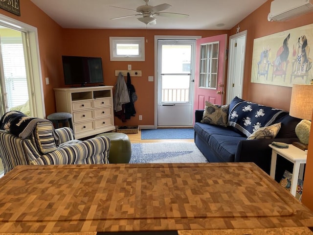 412 Post Rd Unit 253, Wells, ME 04090 - living room with a wall mounted AC, a ceiling fan, and baseboards