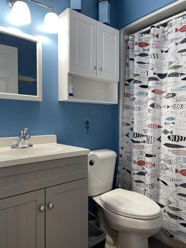 412 Post Rd Unit 253, Wells, ME 04090 - bathroom featuring vanity, toilet, and curtained shower